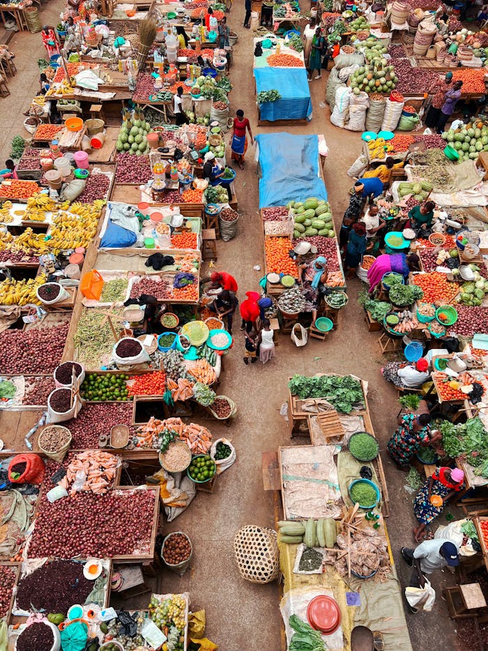 gallery-3 Colorful aerial photo capturing a busy food market with diverse fresh produce and market stalls.